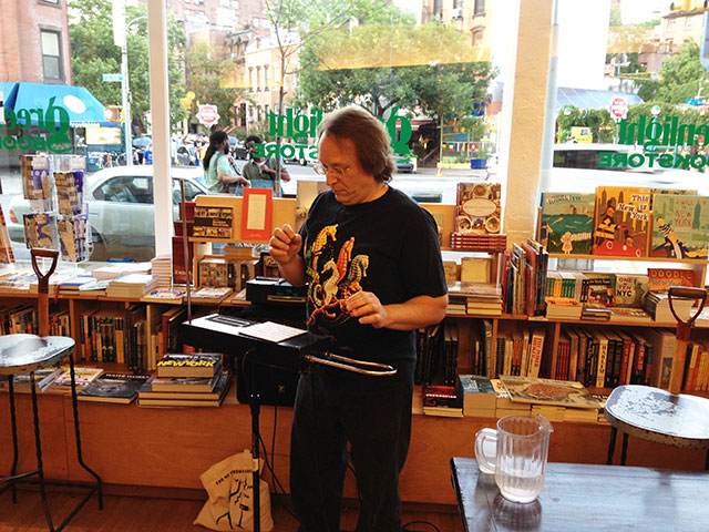 Rob Schwimmer plays the theremin at Greenlight Bookstore in Brooklyn during the launch of Us Conductors by Sean Michaels